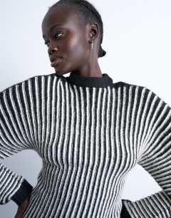 Model wearing Cocoon plated ribbed jumper in black and white