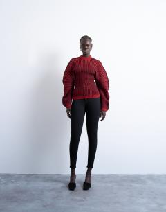 Model wearing Cocoon plated ribbed jumper in red