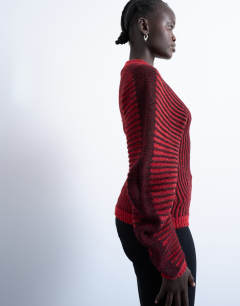 Model wearing Cocoon plated ribbed jumper in red