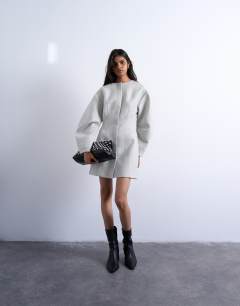 Model wearing Cocoon structured mini dress in woven grey marl