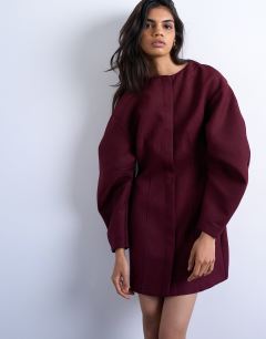 Model wearing Cocoon structured mini dress in woven port royale