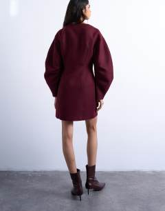 Model wearing Cocoon structured mini dress in woven port royale