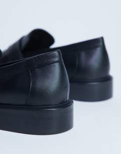 Model wearing Cole premium real leather square toe loafers in black