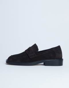 Model wearing Cole Premium suede loafer in chocolate