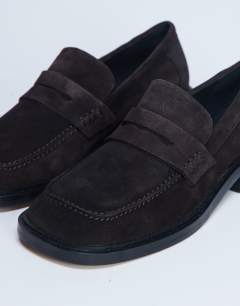 Model wearing Cole Premium suede loafer in chocolate