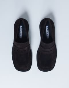 Model wearing Cole Premium suede loafer in chocolate