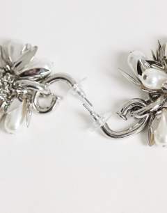 Model wearing Colette flower cluster drop earring in silver and pearl