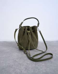 Model wearing Colette real suede bucket bag in khaki