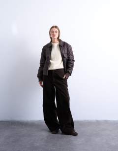 Model wearing Collared liner cropped bomber jacket in chocolate