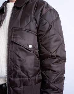 Model wearing Collared liner cropped bomber jacket in chocolate