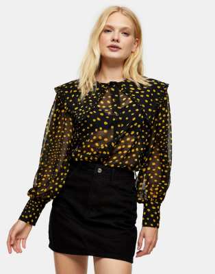 yellow top with black polka dots