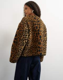 Model wearing Collareless cord fleece jacket in animal print
