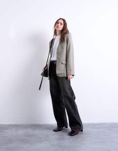 Model wearing Collarless chuck on blazer in grey check