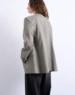 Model wearing Collarless chuck on blazer in grey check