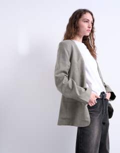 Model wearing Collarless chuck on blazer in grey check