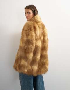 Model wearing Collarless mid length faux fur coat in multi