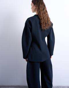 Model wearing Collarless structured blazer in navy