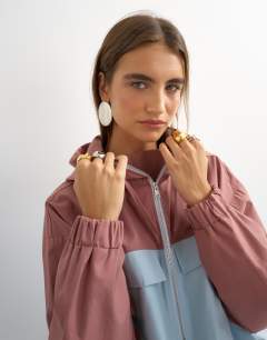Model wearing Colour block bomber in blue and mauve 
