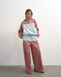 Model wearing Colour block bomber in blue and mauve 