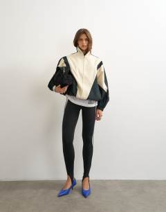 Model wearing Colour block funnel neck jacket in ecru