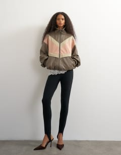 Model wearing Colour block leather look track jacket in pink