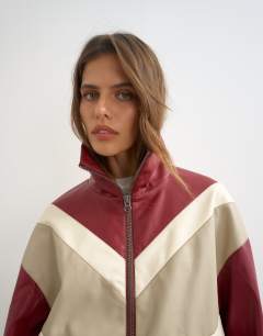 Model wearing Colour block leather look track jacket in red