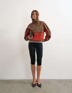 Model wearing Colour block pocket detail zip up jacket in brown and red