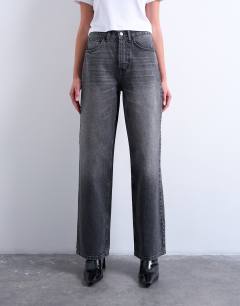 Model wearing Column low rise relaxed fit jean circular design in washed black