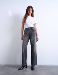 Model wearing Column low rise relaxed fit jean circular design in washed black