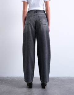 Model wearing Column low rise relaxed fit jean circular design in washed black