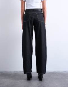 Model wearing Column mid rise jean in black ecru
