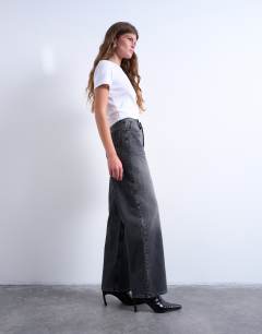 Model wearing Column mid rise jean in washed black