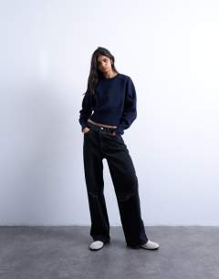 Column mid rise jean with rip in washed black