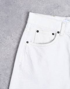 Model wearing Column mid rise jeans in bone