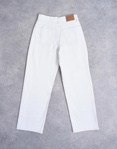 Model wearing Column mid rise jeans in bone