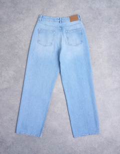 Model wearing Column mid rise low slung jean in bleach