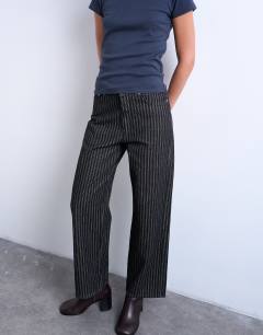Model wearing Column mid rise straight jean in black stripe
