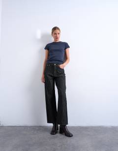 Model wearing Column mid rise straight jean in black stripe
