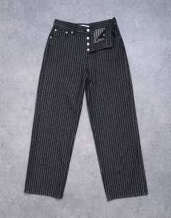 Model wearing Column mid rise straight jean in black stripe