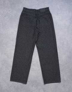 Model wearing Column mid rise straight jean in black stripe