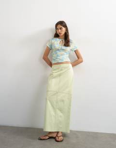 Model wearing Column midi skirt with contrast stitch detail in light green