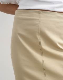 Model wearing Column midi skirt with contrast stitch detail in stone