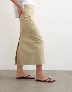 Model wearing Column midi skirt with contrast stitch detail in stone