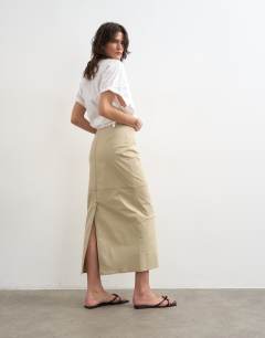 Model wearing Column midi skirt with contrast stitch detail in stone