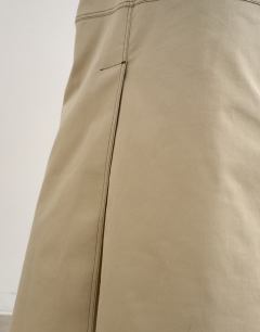 Model wearing Column midi skirt with contrast stitch detail in stone