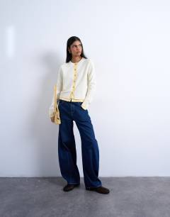 Model wearing Compact knitted double layer cardigan in ivory and yellow