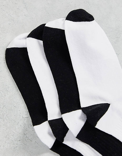 Asos Sport & Swimwear Abbigliamento sportivo Intimo sportivo Confezione da due paia di calze sportive bianche e nere 