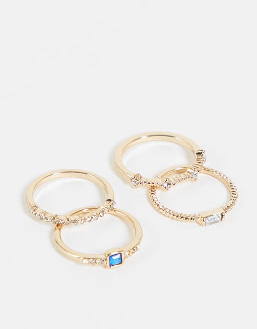 Topshop - Confezione multipack da 4 anelli impilabili oro e blu con cristalli squadrati