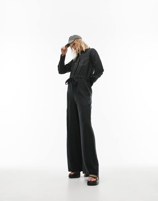 Black jumpsuit with store white stitching