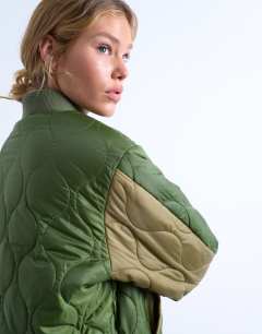 Model wearing Contrast liner bomber jacket in green